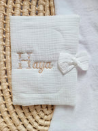 Personalised baby health record cover in cotton gauze – With bow