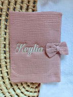Personalised baby health record cover in cotton gauze – With bow