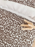 Couverture en gaze de coton et polaire blanc léopard