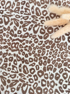 Couverture en gaze de coton et polaire blanc léopard